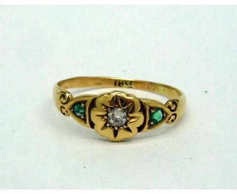 An 18ct gold, emerald and diamond ring, weight 2.4g, size Q