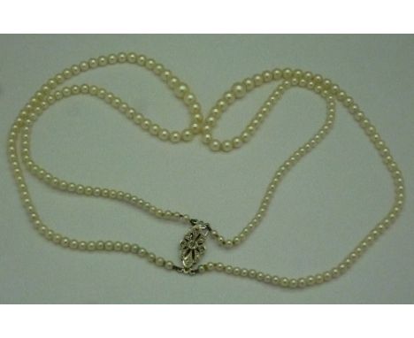 A pearl necklace with 9ct white gold and diamond clasp