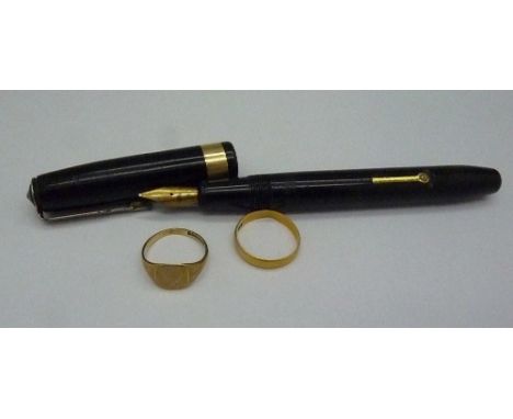An 18ct gold wedding band, weight 2g, size N, a 9ct gold ring, weight 1.7g, size K and a Conway Stewart pen with 14ct gold ni