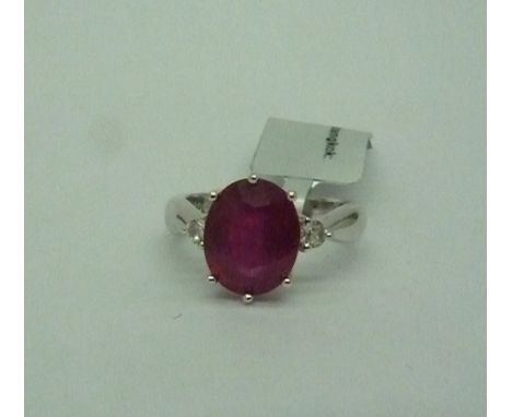 A silver Madagascan ruby and white topaz ring, ruby weight 3.87ct, total weight 3.15g, with certificate
