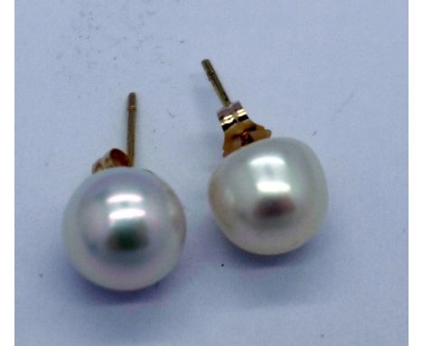 A pair of pearl earrings with 9ct gold mounts