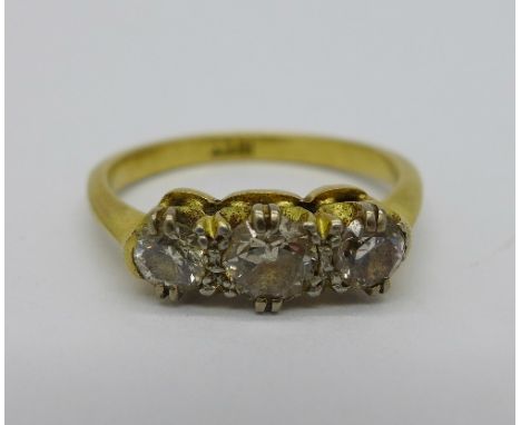 An 18ct gold and three stone diamond ring, weight 2.5g, size I