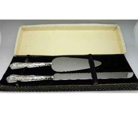 A silver handled bread knife and cake server