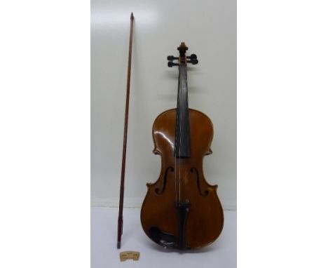 A violin with Antonio Stradivarius paper label, with bow, cased, length of back without button 35.5cm