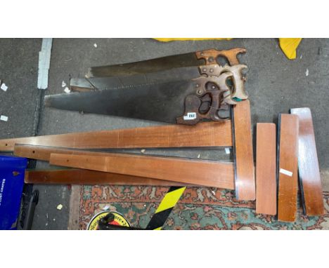 A SELECTION OF VINTAGE SAWS AND WOODEN MEASURING TOOLS
