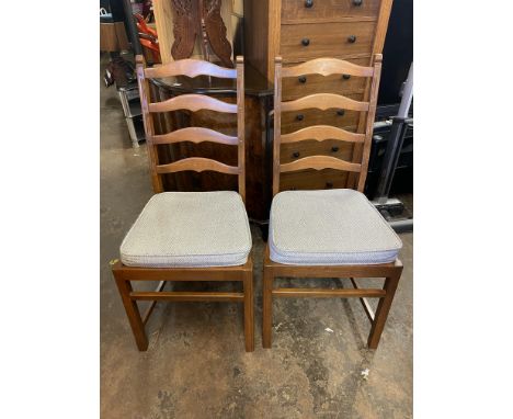 ERCOL CIRCULAR EXTENDING DINING TABLE AND CHAIRS