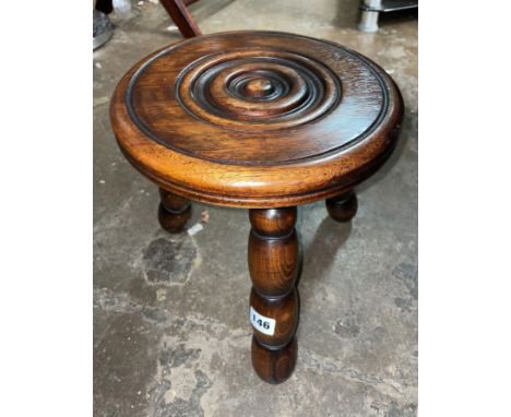 CARVED ROUNDEL TOPPED MILKING STOOL ON BOBBIN REEL LEGS 
