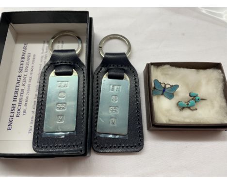 TWO SILVER INGOT LEATHER POSH CLUB KEYRINGS, SILVER ENAMEL BUTTERFLY BROOCH AND A ROADRUNNER BROOCH