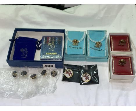 TWO TIFFANY &amp; CO PLATED CUNARD OCEAN LINER LAPEL BADGES, TWO OTHERS AND ENAMEL BADGES