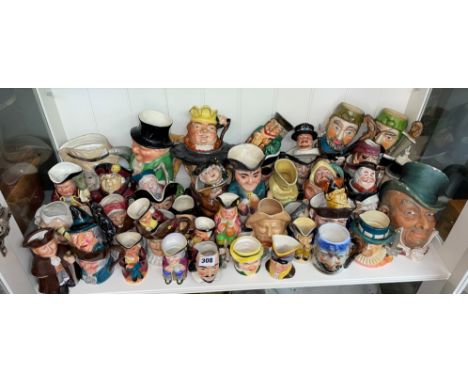 A LARGE SHELF OF CHARACTER AN TODY JUGS