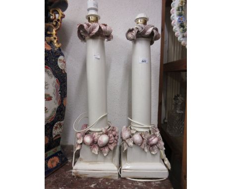Pair of large Continental foliate and fruit encrusted column form lamp bases (at fault), 24ins high approximately 
