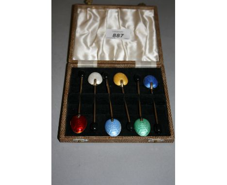 Set of six Birmingham silver gilt and enamel decorated coffee bean handled spoons, in fitted box 