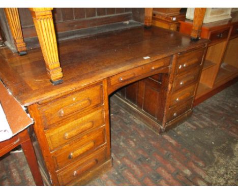 Early 20th Century oak twin pedestal desk (converted from roll-top desk)measures 55in wide - the back of this desk top still 