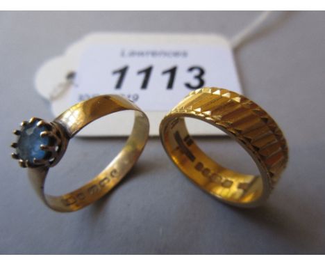 22ct Gold wedding band together with another 22ct gold ring set blue zirconWeight is 7g 