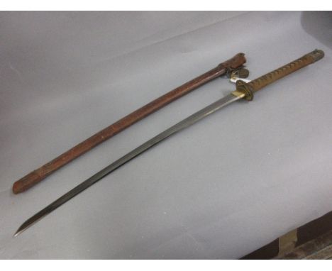 World War II Japanese katana with remnants of gilding to the tsuba and other fittings, having shagreen grip and leather cover