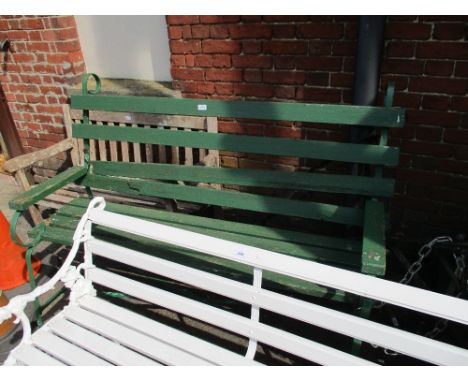 Green painted iron ended scroll work garden bench with slatted back and seats, 5ft long (at fault) 