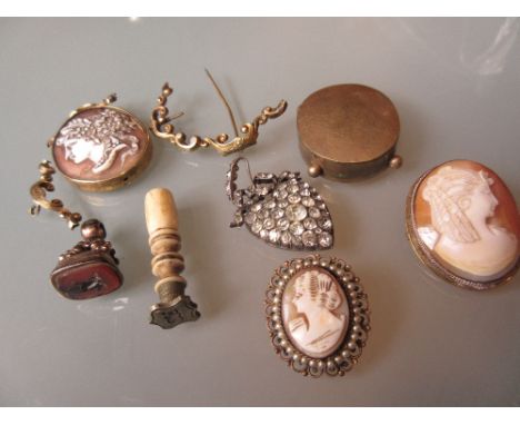 Three various carved cameo portrait brooches, memorial brooch (at fault), Victorian paste heart shaped pendant and two seals 