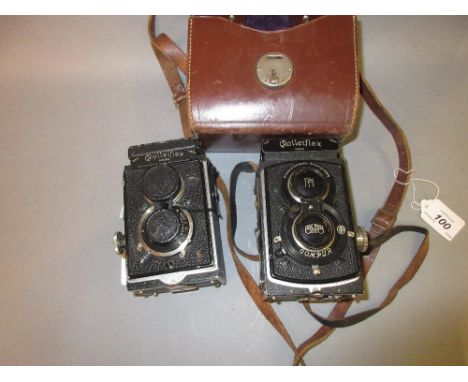 Rolleiflex twin lens camera in original leather case, another similar and another case lacking 