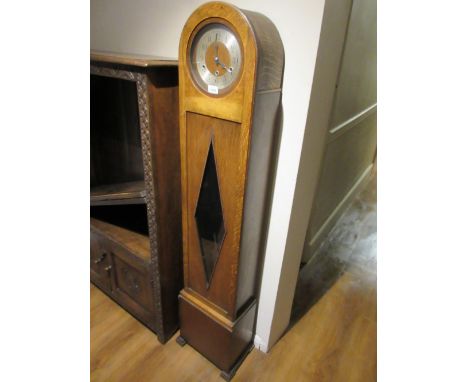Mid 20th Century oak Grandmother clock having silvered chapter ring with Arabic numerals and three train Westminster chiming 
