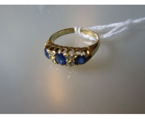 Gold three stone sapphire and diamond set ring 