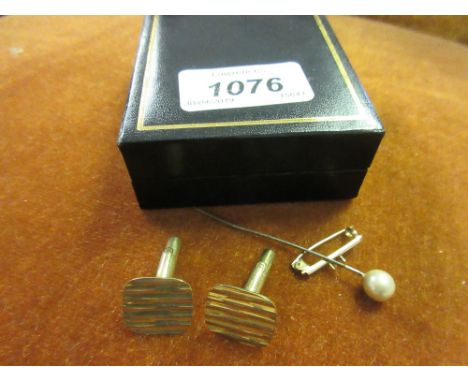 Pair of 9ct gold cufflinks and a small yellow metal bar 