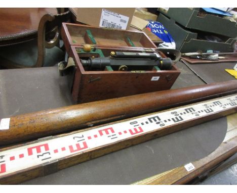 Stanley black Japanned brass surveyors level, No. 26072, housed in a mahogany case together with tripod and measure 