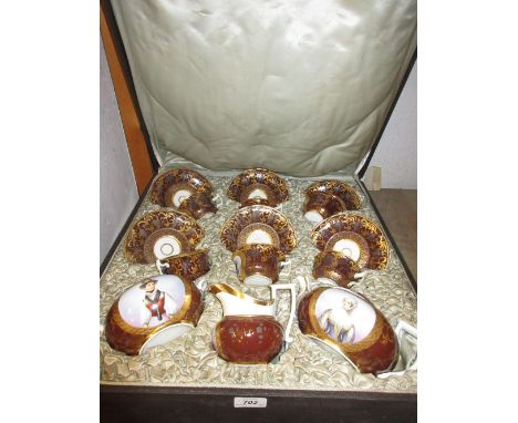 19th Century Paris porcelain teapot, sucrier and cream jug together with six matching cups and saucers in a fitted case, the 