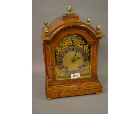 Late 19th / early 20th Century oak cased bracket clock, the brass dial having silvered chapter ring with Roman numerals and f