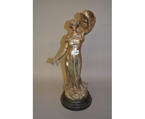 Silvered spelter figural table lamp in the form of classical female holding a torch, 26ins high overall 