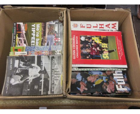 Two boxes containing a large collection of over four hundred Fulham football programmes from the 1960's 