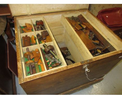 Large 19th Century oak tool chest, the hinged cover enclosing a painted fitted interior with graduated drawers containing a l