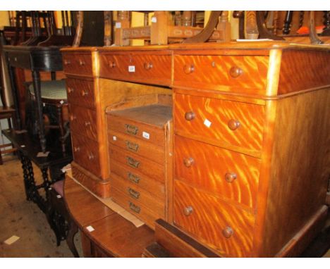 Late 19th Century satin birch pedestal desk having an arrangement of nine drawers with knob handles, raised on plinth bases, 