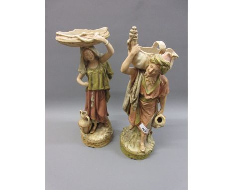 Pair of Royal Dux matt glazed and shot enamel decorated figures of water carriersMale 16in   - Female 15in 