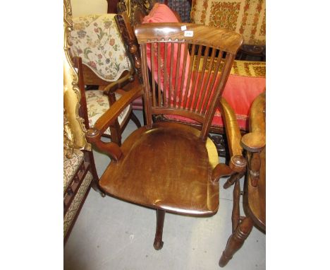 Early 20th Century mahogany open arm revolving office chair having slatted back, on cabriole supports with brass and ceramic 