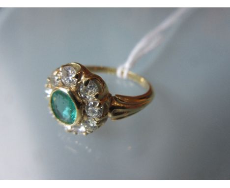 18ct Yellow gold oval emerald and diamond cluster ring 