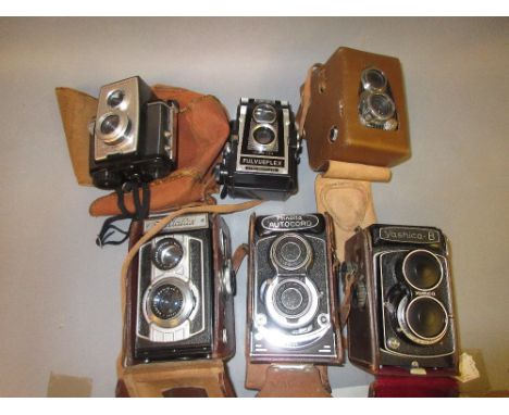 Yashica B twin lens camera in original case, similar Welta camera, similar Ilford camera and three other various similar came