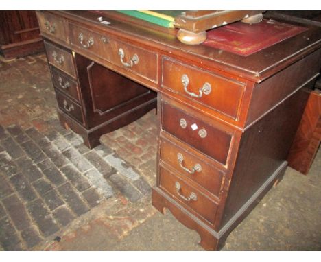 Reproduction mahogany twin pedestal desk, together with reproduction leather upholstered revolving office chair (at fault) 