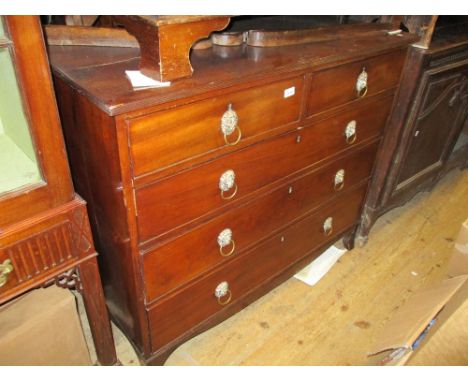 Regency mahogany straight front chest of two short and three long graduated drawers with lion mask ring handles and splay bra