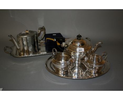 Three piece circular plated tea service, two plated trays and a cased plated Christening mug 