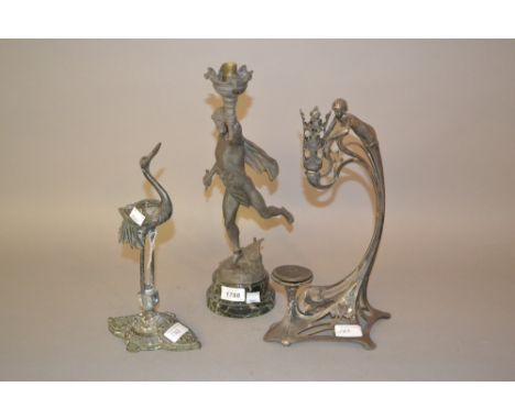 W.M.F. figural candle holder together with a French spelter figural table lamp and a brass figure of a stork 