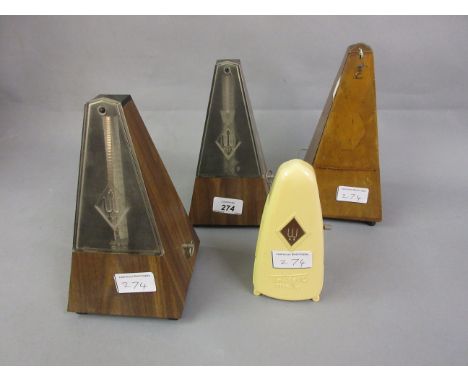 20th Century faux wood cased metronome together with another similar, a Taktell piccolo metronome and another 