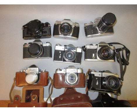 Canon A1 35mm camera, a Rolleiflex SL35, Zenit-E and six other various 35mm camerasVarious damages to outer bodies - some scr