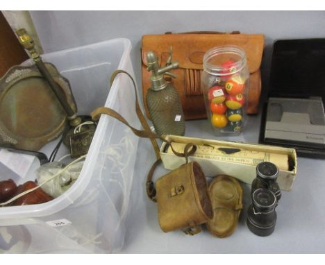 Wire covered soda siphon, pair of binoculars in leather case, brass table lamp and a quantity of other miscellaneous items 