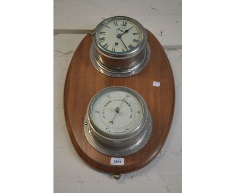 Nickel plated ship's bulkhead clock and barometer on an oval mahogany mount 