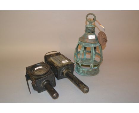19th Century Veritas of London black japanned metal carriage lamp, together with another carriage lamp and a green patinated 
