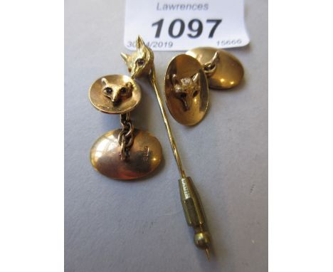 Pair of 9ct gold fox head cufflinks with garnet set eyes, together with a similar fox head tie pin 