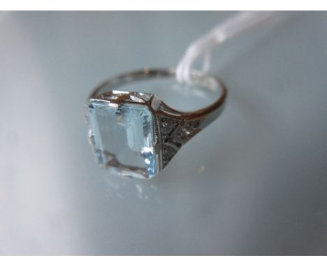 Platinum ring set rectangular aquamarine with diamond set shoulders 