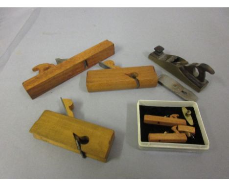 Quantity of miniature woodworking tools including a brass and rosewood plane 