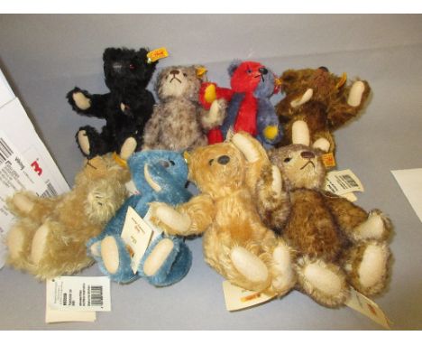 Group of eight small modern Steiff teddy bears of various colours 