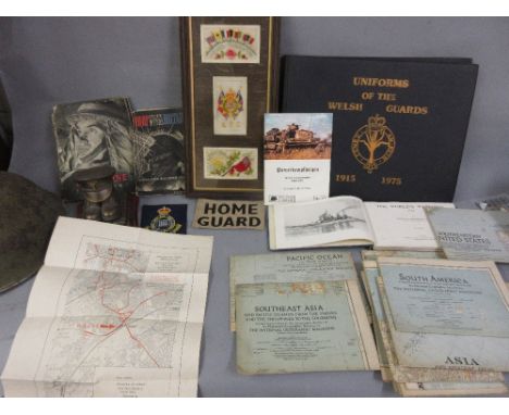 Group of three World War I silk postcards, framed, together with two cloth badges, a reproduction composite military sculptur